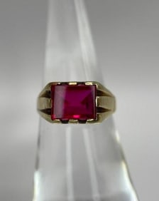 14k gold ring with ruby colored stone