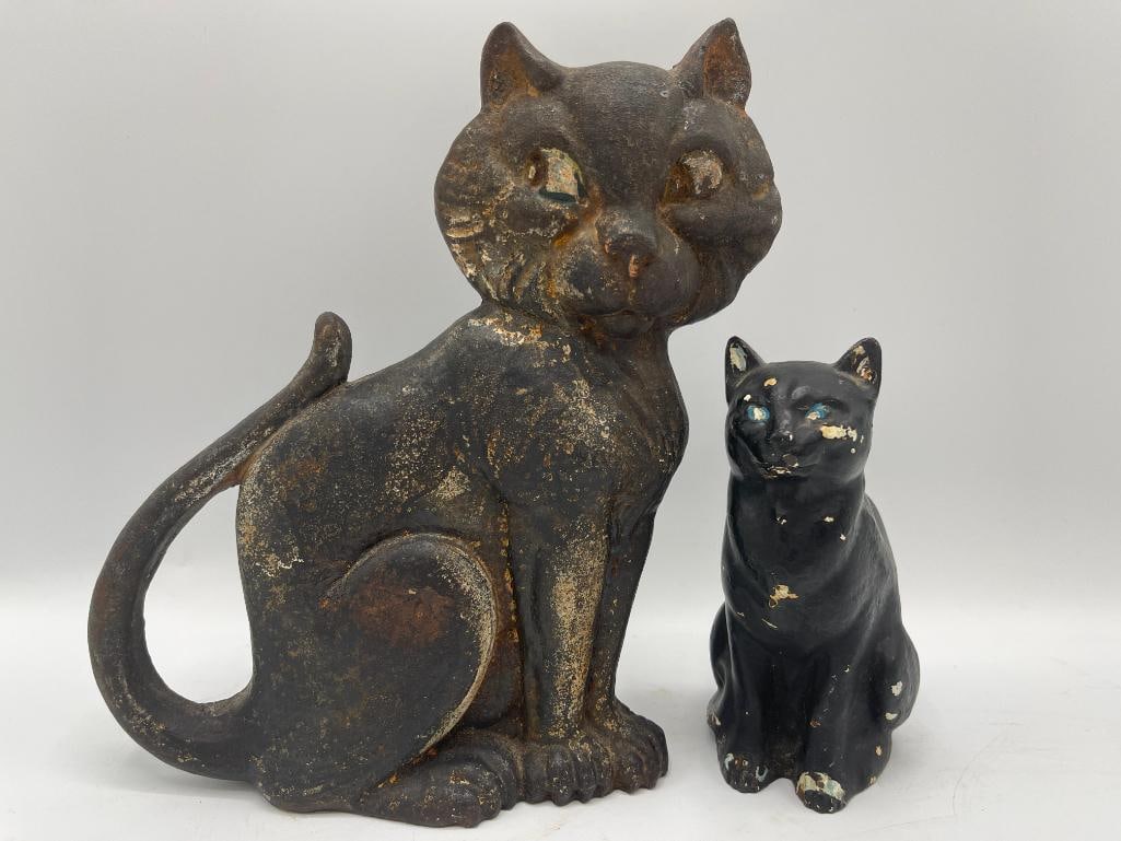 2 cast iron cat doorstops, A.M. Greenblatt: 2 cast iron cat doorstops, A.M. Greenblatt. 2 pieces. Approx. 9x7x3 inches.