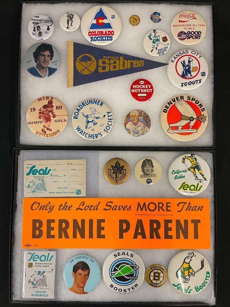 Vintage group of hockey booster buttons, Seals schedule, Sabres pennant and more: Vintage group of hockey booster buttons, Seals schedule, Sabres pennant and more. Approx. 25 pieces.
