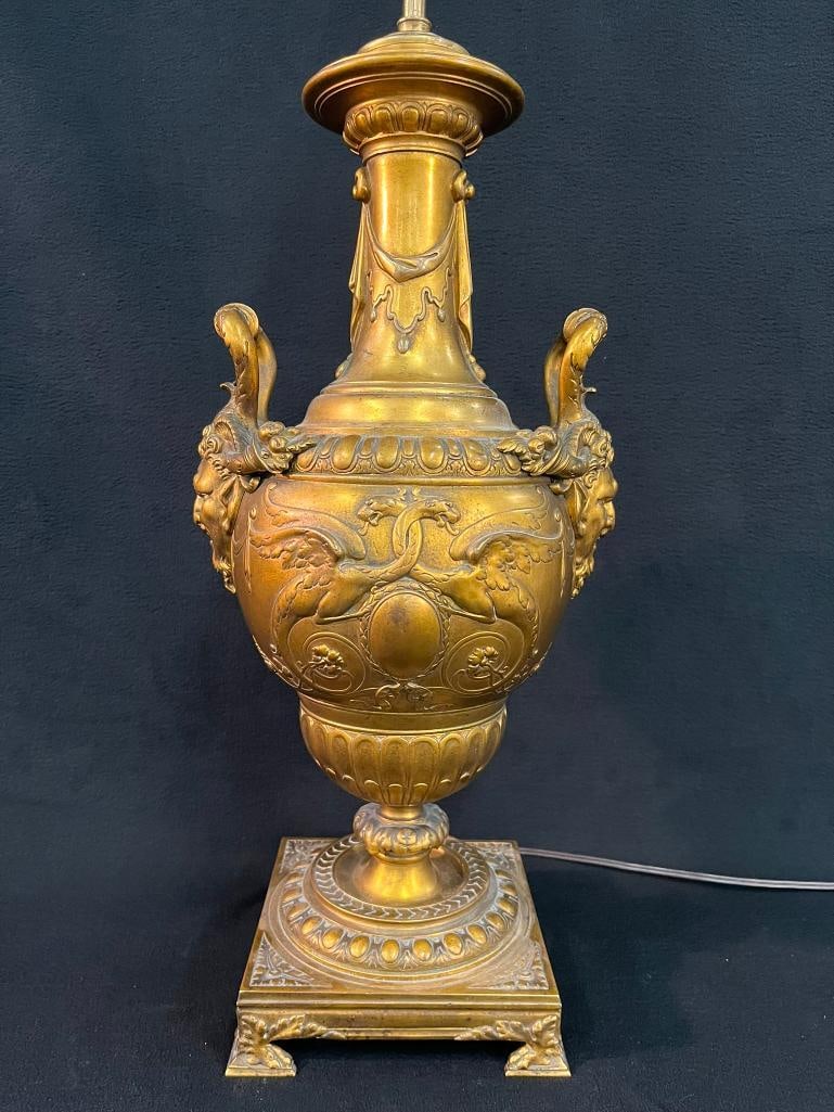 Victorian gilded lamp with Devil faces: Victorian gilded lamp with Devil faces. Approx. 34x8x8 inches.