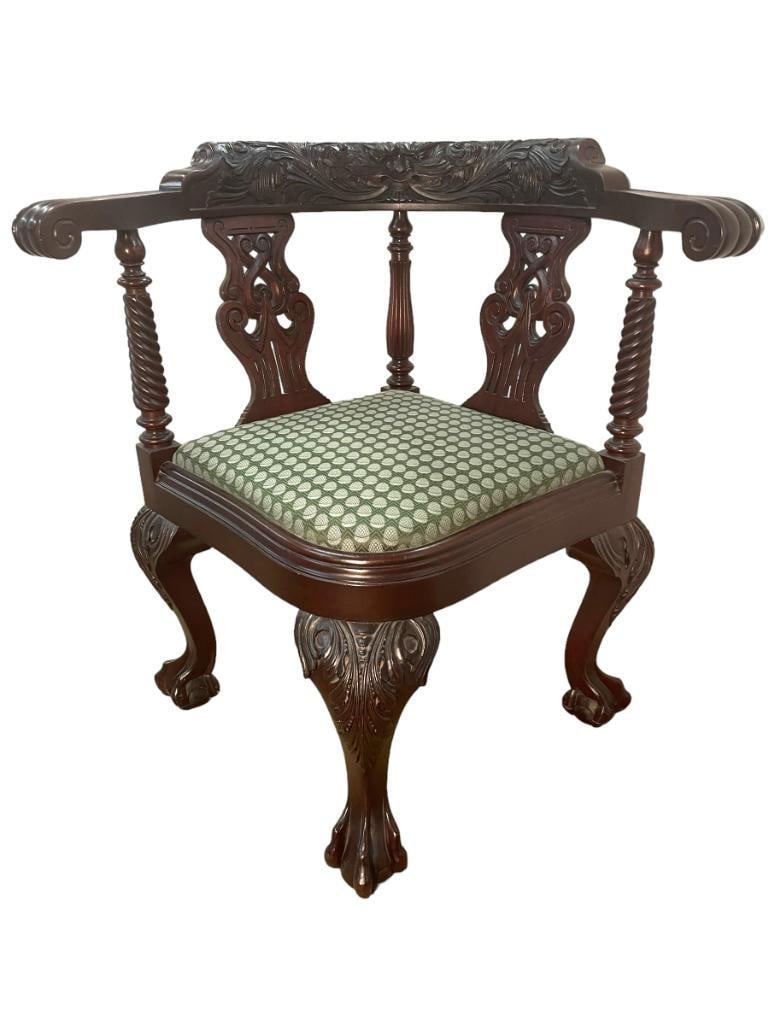 Carved Mahogany corner chair: Carved Mahogany corner chair. Approx. 32x20x20 inches.