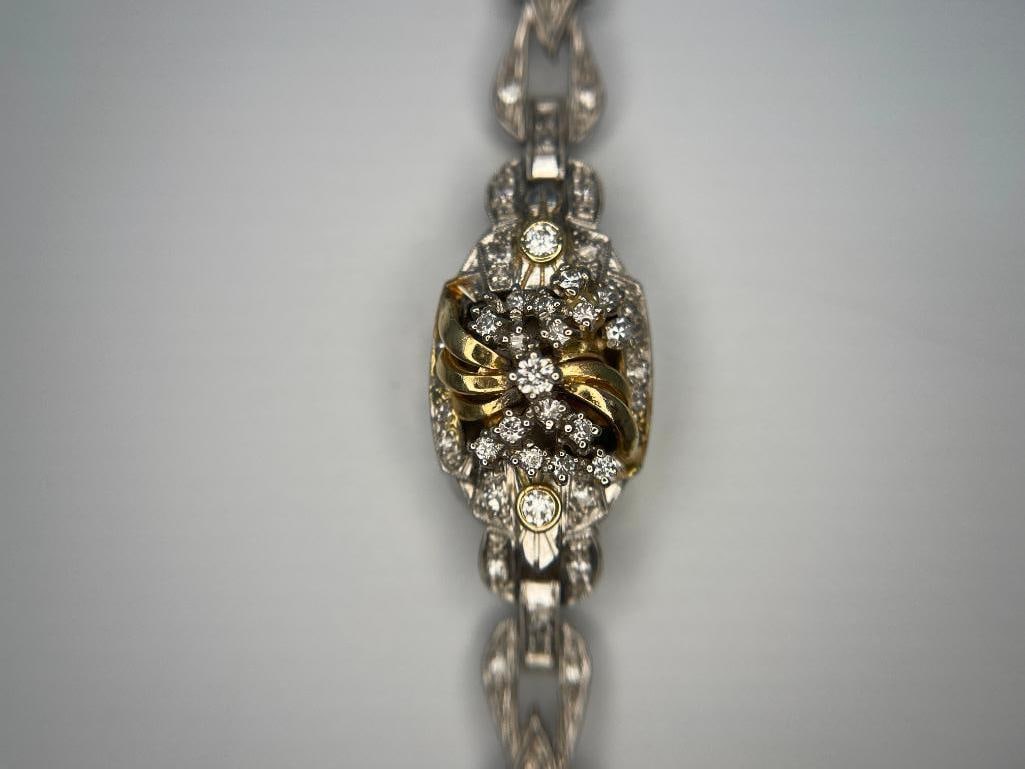 Platinum watch case with diamonds: Platinum watch case with diamonds.