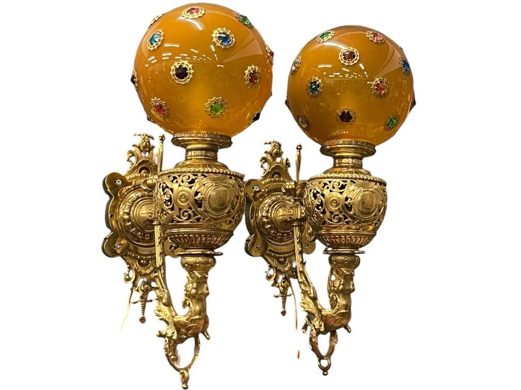 Pair of brass wall peg lamps with Dragons and jeweled shades: Pair of brass wall peg lamps with Dragons with Jeweled Shades. 2 pieces. Approx. 18x8x15 inches.