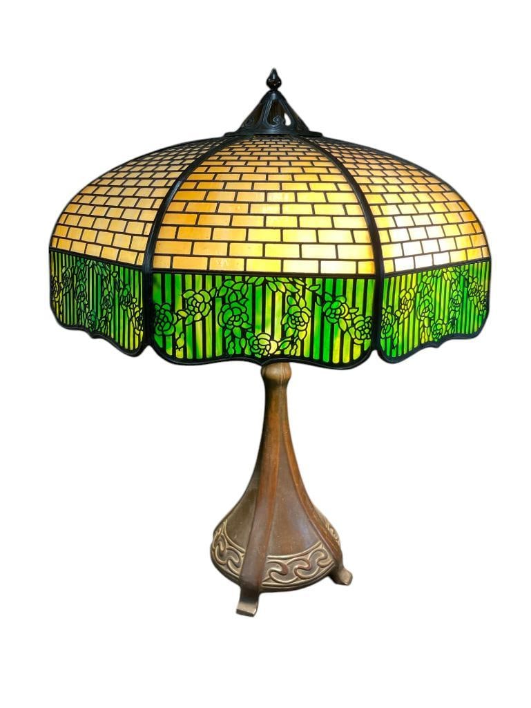 8 Panel Handel Shade on Handel Base: 8 Panel Handel Shade on Handel Base. Approx. 25x18x18 inches. Provenance: From the Monte Hoffman Collection.