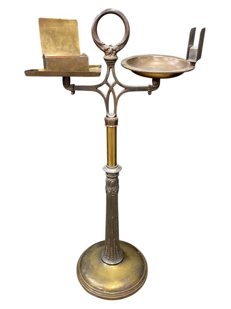 Bradley & Hubbard Brass and Iron Smoking stand: Bradley & Hubbard Brass and Iron Smoking stand. Approx. 15x8x29 inches. Provenance: From the Monte Hoffman Collection.