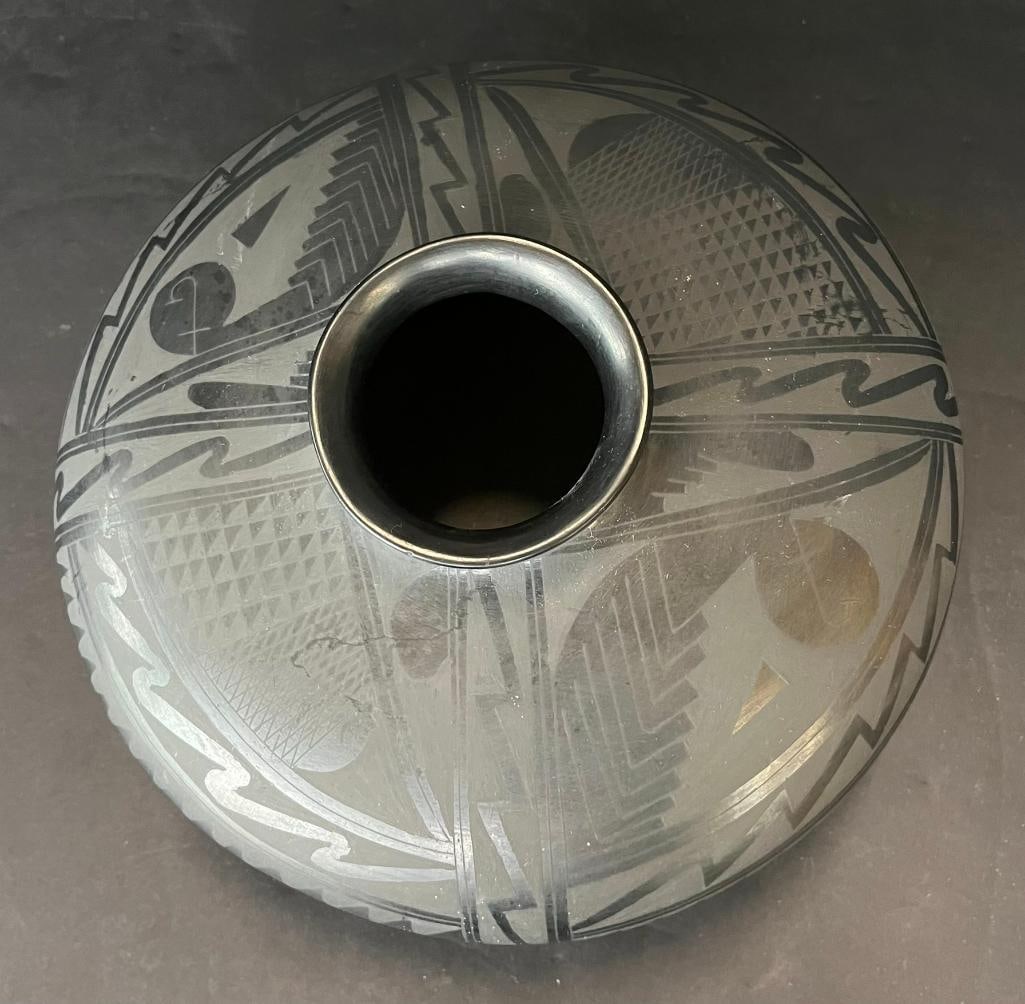 Manuel Reyes signed Black on Black pottery jar: Manuel Reyes signed Black on Black pottery jar. Approx. 6x10x10 inches.Provenance: From the Monte Hoffman Collection.