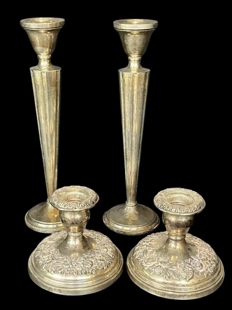 Group of sterling silver weighted candlesticks: Group of sterling silver weighted candlesticks. 4 pieces.