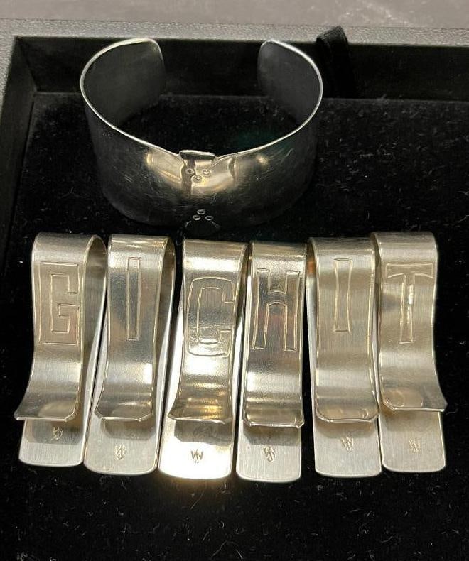 Walter Jennings cuff and napkin holders: Walter Jennings cuff and napkin holders. 7 pieces.