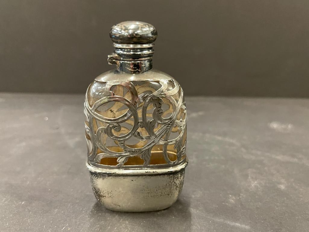Alvin Sterling silver and glass flask with fitted cup: Alvin Sterling flask with fitted cup. Approx. 4x2x1 inches.