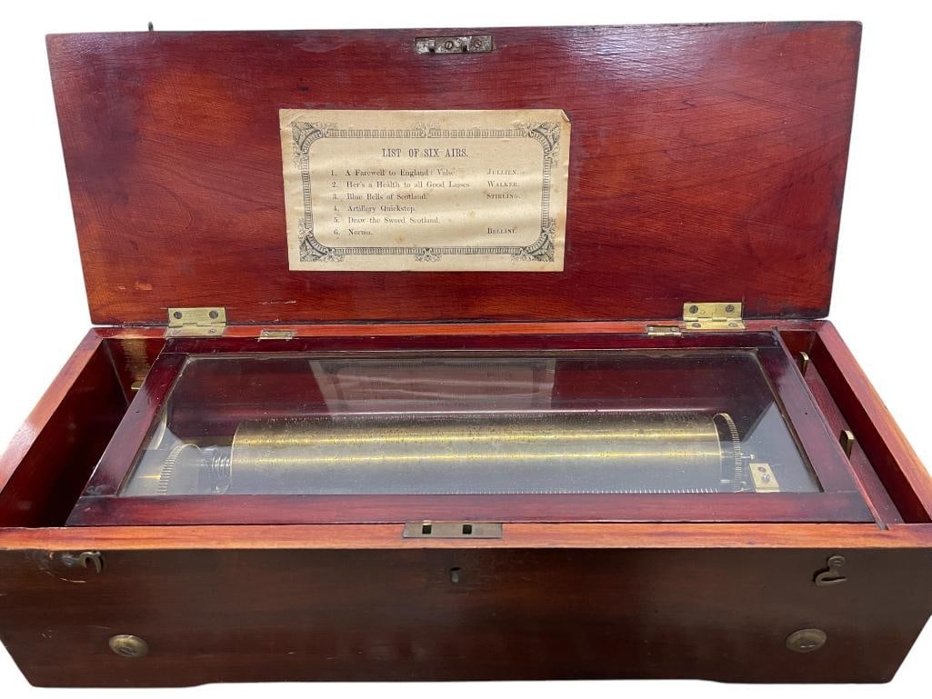 Music Box playing Six Airs: Music Box playing Six Airs. 7x18x6 inches.