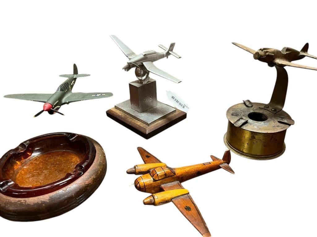 Trench Art ashtray and airplane models: Trench Art ashtray and airplane models. 4 pieces. Approx. 7x7x7 inches.