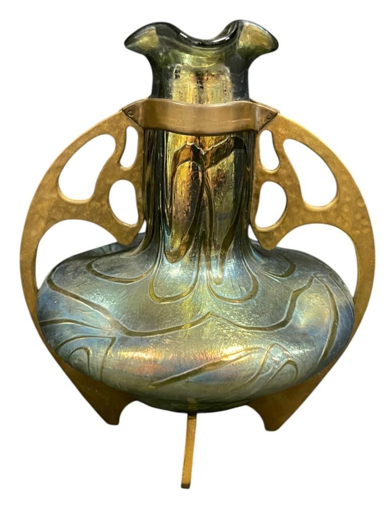 Art Nouveau Glass Vase in Brass Holder Loetz: Art Nouveau Loetz Glass Vase in Brass Holder by Fritz Heckert. Approx. 8x7x7 inches.