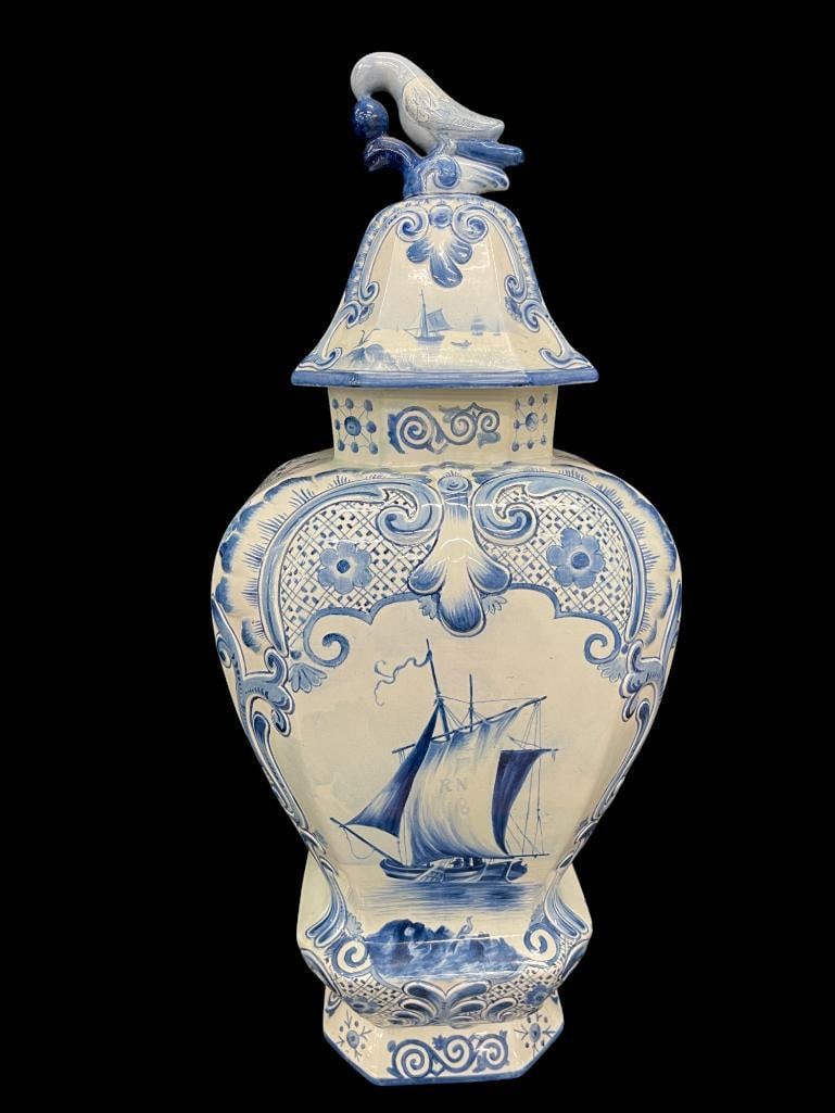 Blue Covered Decorated Urn with Flowers, Ships and Bird Finial: Blue Covered Decorated Urn with Flowers, Ships and Bird Finial. Approx. 10 x 11 x 26 inches.