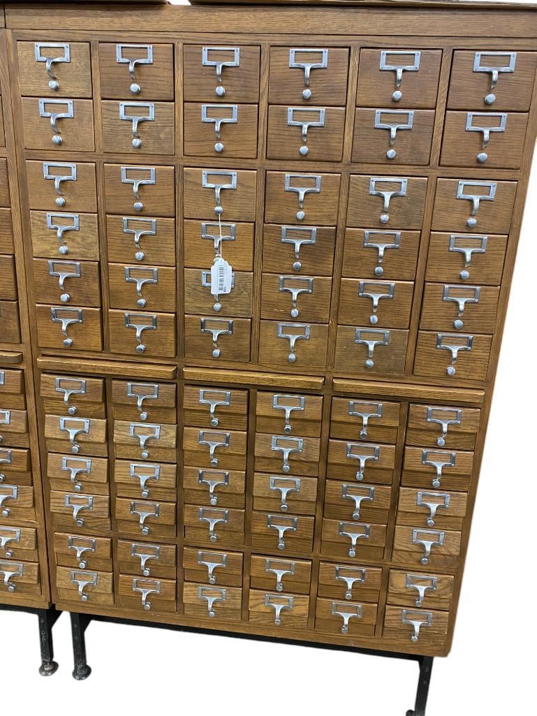72 Drawer Oak Card Catalog Unit on Iron Base with 3 Pull Out Trays: 72 Drawer Oak Card Catalog Unit on Iron Base with 3 Pull Out Trays. Approx. 64 x 40 x 19 inches.