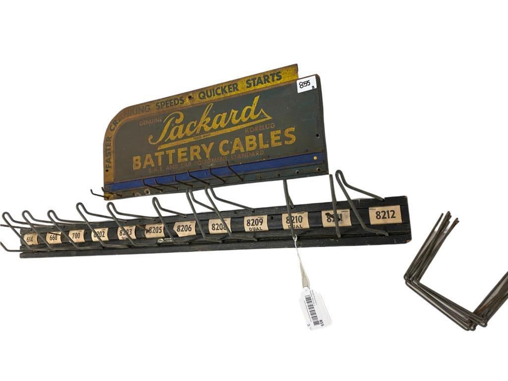 Packard Battery Cables Tin Sign and Gates Rubber Belt Rack: Packard Battery Cables Tin Sign and Gates Rubber Belt Rack. Packard approx. 8.5 x 20 inches. Gates approx. 36 x 3 x 6 inches.