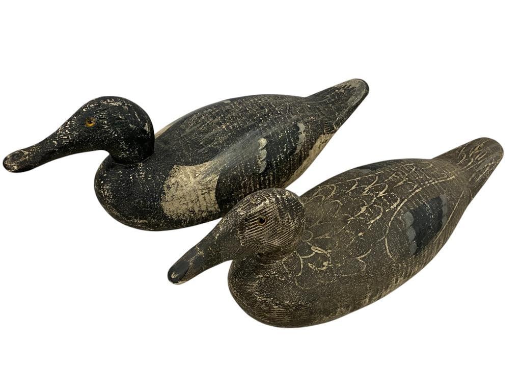 2 Carved Wood Duck Decoys: 2 Carved Wood Duck Decoys. Approx. 17 x 6 x 5.5 inches.