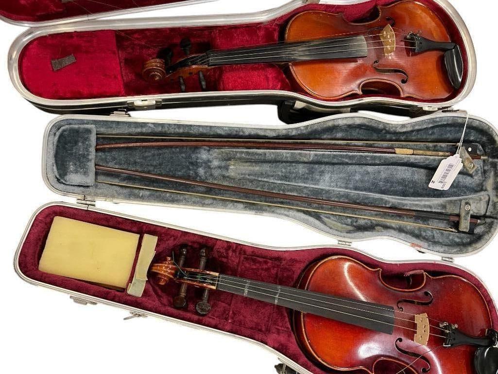 German Violin and Stradivarius Copy with Cases: German Violin and Stradivarius Copy with Cases. Approx. 10 x 31 inches.