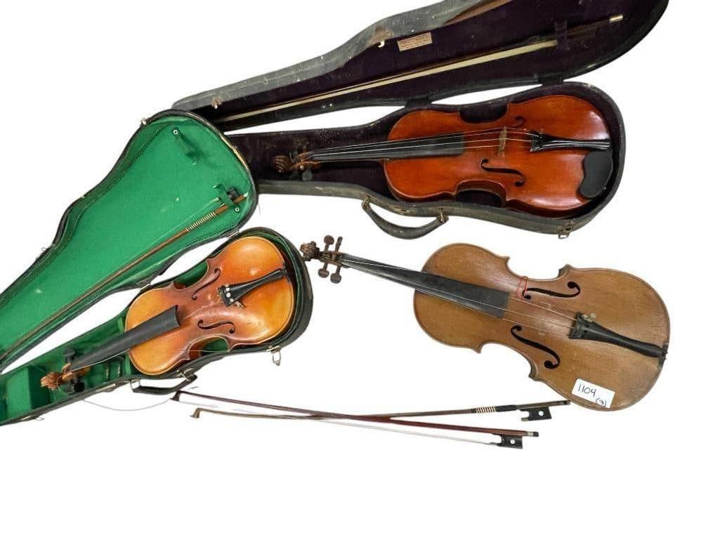 Stradivarius Violin Copy and 2 Others with Bows and Cases: Stradivarius Violin Copy and 2 Others with Bows and Cases. Approx. 10 x 31 inches.
