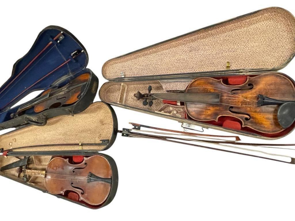 Group of 3 Violins in Cases: Group of 3 Violins in Cases. One marked Antonius Stradivarius. One Japan and 1 Made in Nippon Bow with mother of pearl inlay. Approx. 30 x 9 x 5 inches.