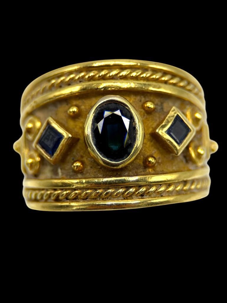 18k Gold and Sapphire Ring: 18k Gold and Sapphire Ring. Approx. size 7. Approx. 15 grams.