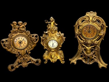 Group of Gilt Cherub Mantle Clocks