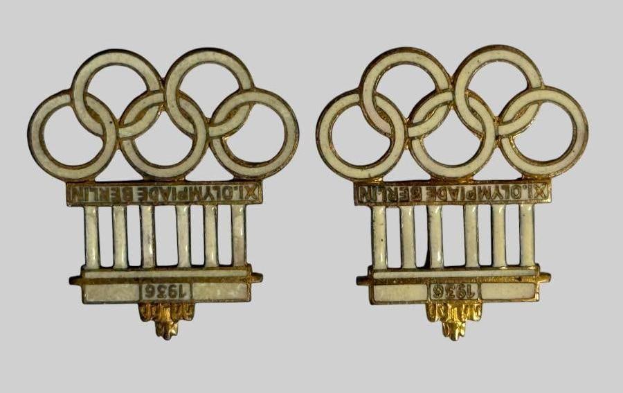 1936 Berlin Olympics Pins: 1936 Berlin Olympics Pins. 2 pins. Approx. 1.25 x 1.25 inches.