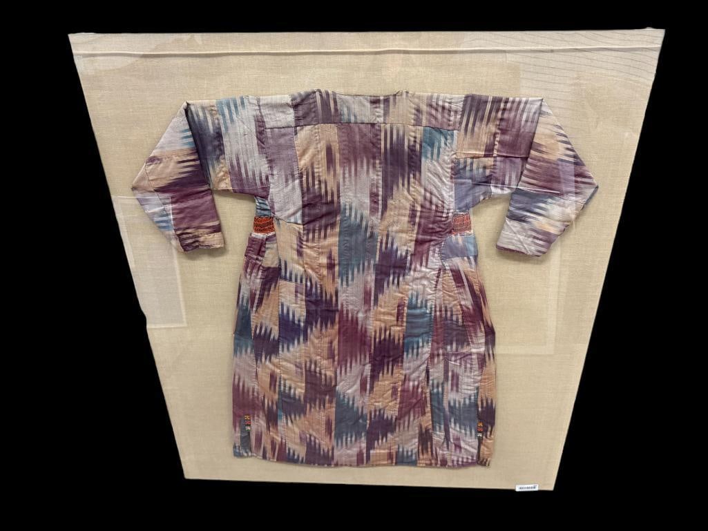 Uzbek Ikat Silk Robe: Early 20th Century Uzbek Ikat Silk Robe from Afghanistan. Mounted on canvas in Acrylic cover. Approx. 47 x 59 inches.