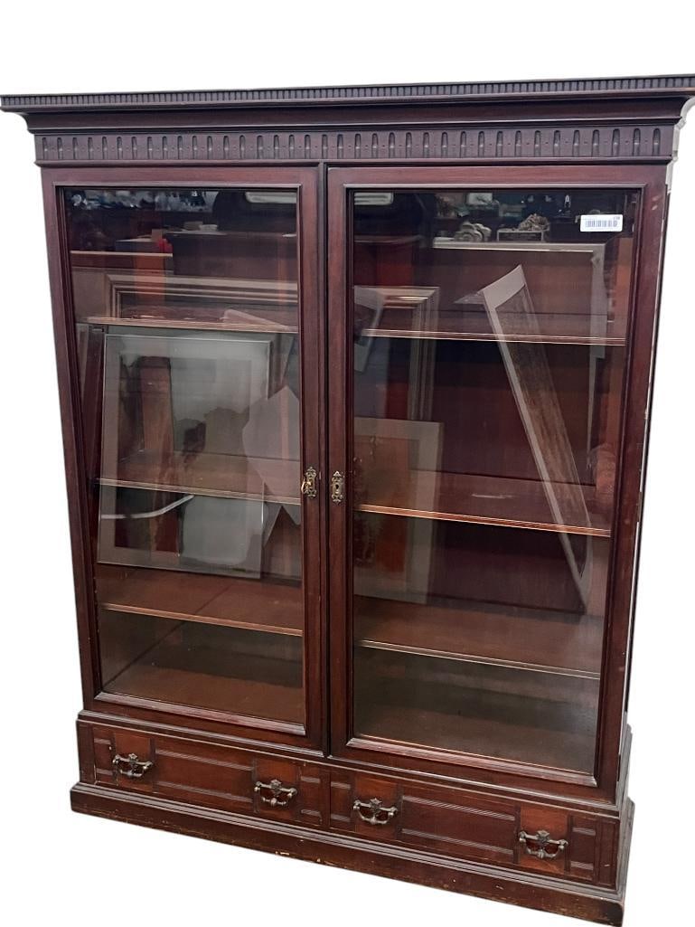 Antique Mahogany Bookcase: Antique Mahogany Bookcase with 2 bottom drawers and 8 shelves. Approx. 62 x 50 x 15 inches.