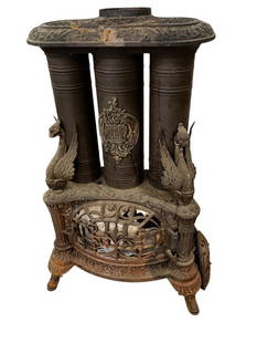Garnet Jewel Cast Iron Parlor Stove: Garnet Jewel Cast Iron Parlor Stove with Phoenixes. Approx. 38 high x 24 wide x 16 deep, inches.