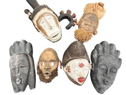 6 African Carved Wood Masks: 6 African Carved Wood Masks. Largest approx. 20 x 8 x 8 inches.