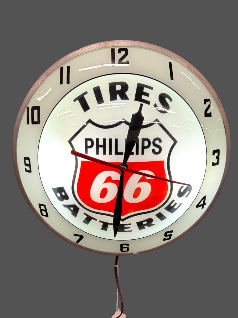 Phillips 66 Double Bubble Lighted Clock: Phillips 66 Tires Batteries Double Bubble Lighted Clock by AP. Approx. 15 inches.