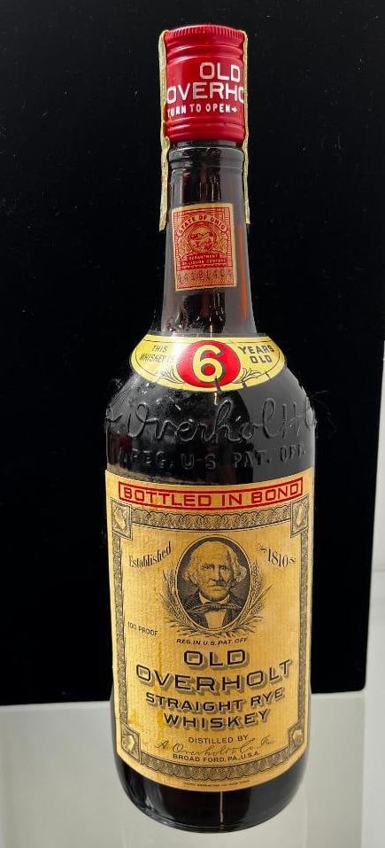 Vintage Old Overholt Straight Rye Whiskey Bottle: Vintage Old Overholt Straight Rye Whiskey Bottle. Approx. 11 inches tall.