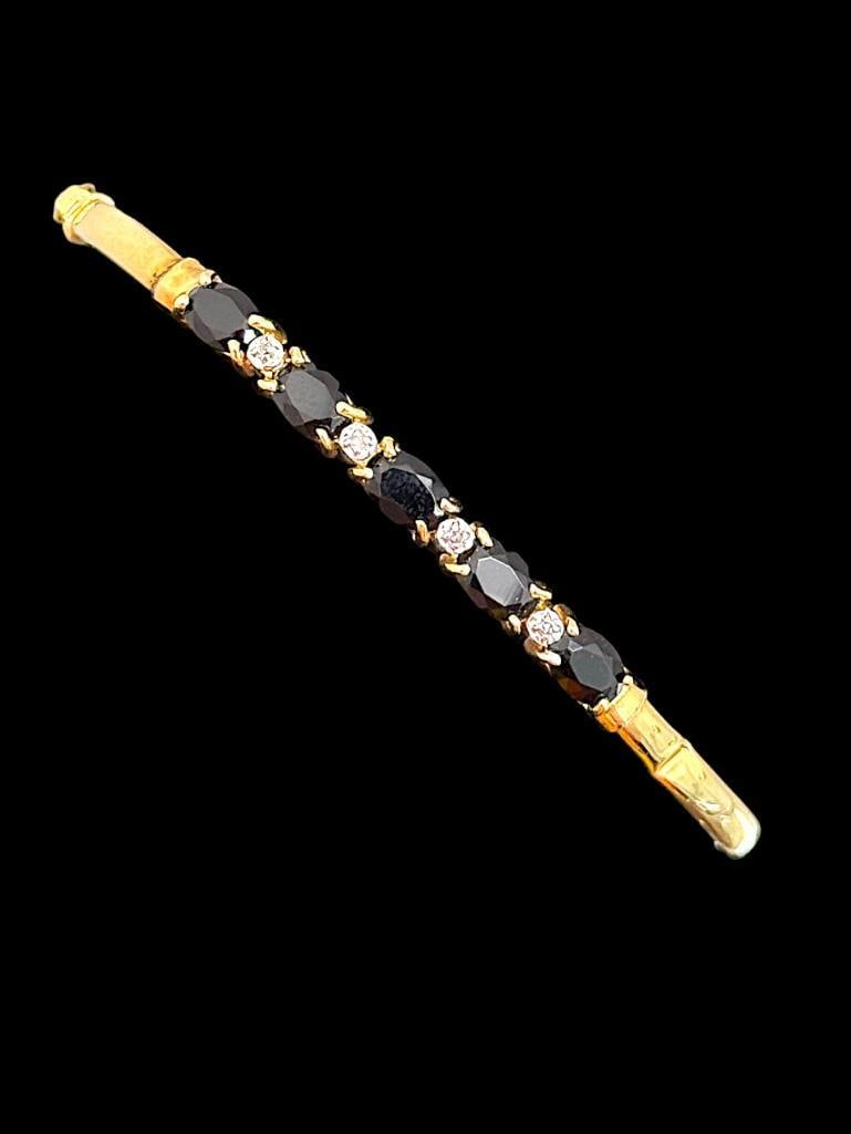 14k Gold Bracelet with Diamonds and Stones: 14k Gold Bracelet with Diamonds and Stones. Approx. 5.1 grams. Inside approx. 2.25 inches.