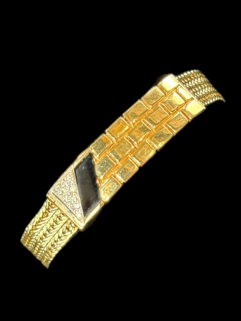 14k Gold and Diamond Bracelet: 14k Gold and Diamond Bracelet. Approx. 25.3 grams. Approx. 7.5 inches.