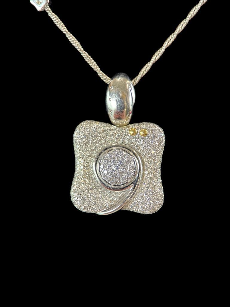 18k Gold and Diamond La Nouvelle Bague pendant: 18k Gold and Diamond La Nouvelle Bague pendant. Approx. 28.7 grams. Chain approx. 15.5 inches from clasp to pendant.