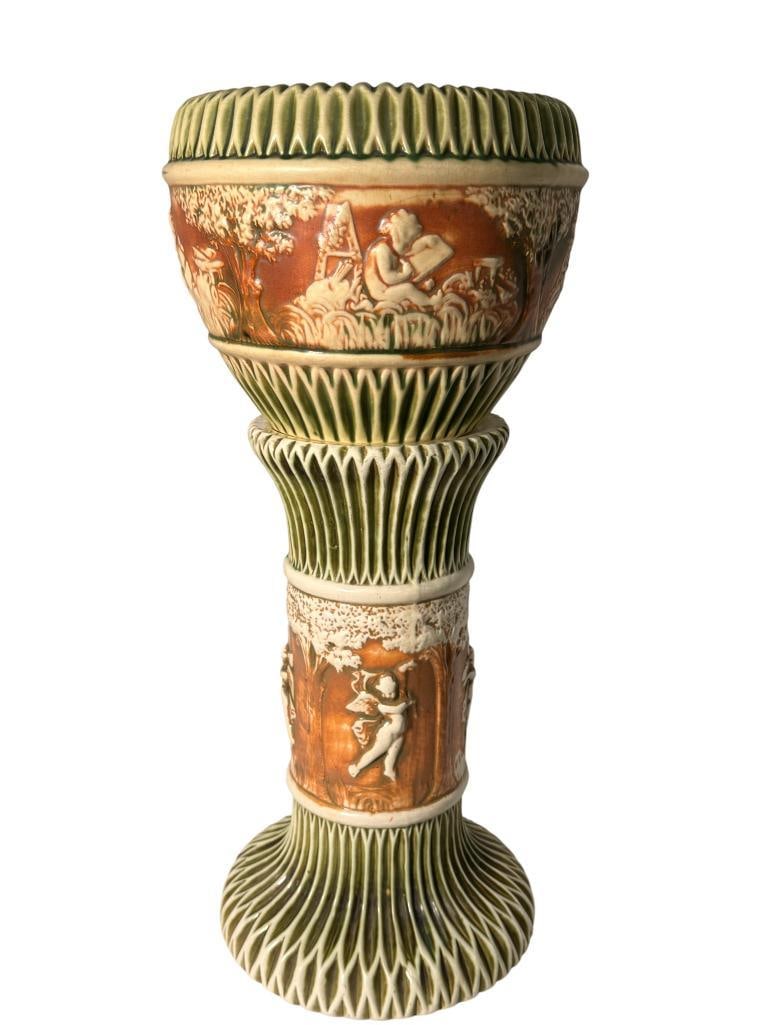 Roseville Pottery Donatello Jardiniere & Pedestal: Roseville Pottery Donatello Jardiniere & Pedestal. Approx. 28 x 13 x 13 inches..