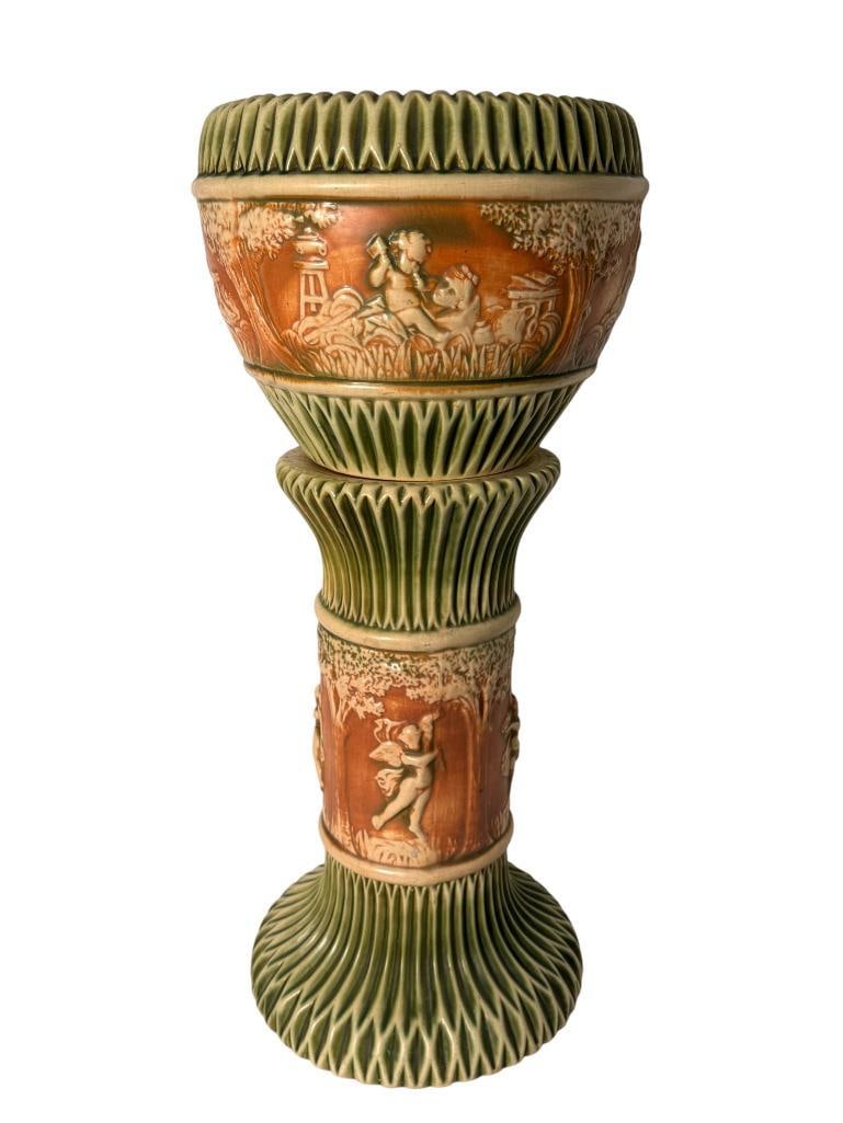 Roseville Pottery Donatello Jardiniere & Pedestal: Roseville Pottery Donatello Jardiniere & Pedestal. Approx. 28 x 13 x 13 inches.