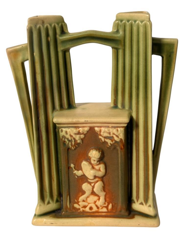 Roseville Pottery Donatello Double Bud Vase: Roseville Pottery Donatello Double Bud Vase. Approx. 7 x 5.5 inches.