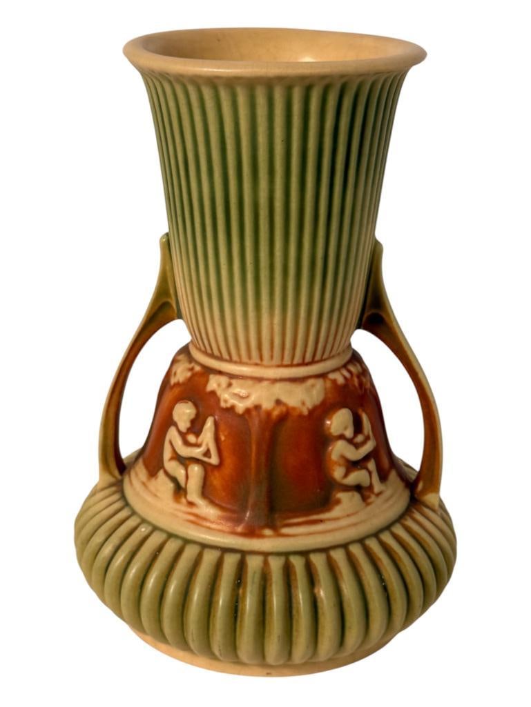 Roseville Pottery Donatello double Handle Vase: Roseville Pottery Donatello double Handle Vase. Approx. 8 inches tall.