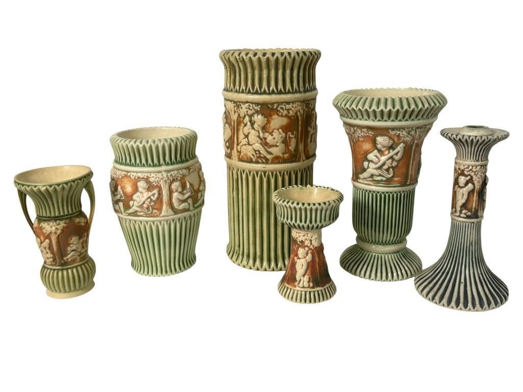 Roseville Pottery Donatello Vases and Candlestick: Roseville Pottery Donatello Vases and Candlestick. 6 pieces. Tallest vase approx. 12 x 5.5 x 5.5 inches.