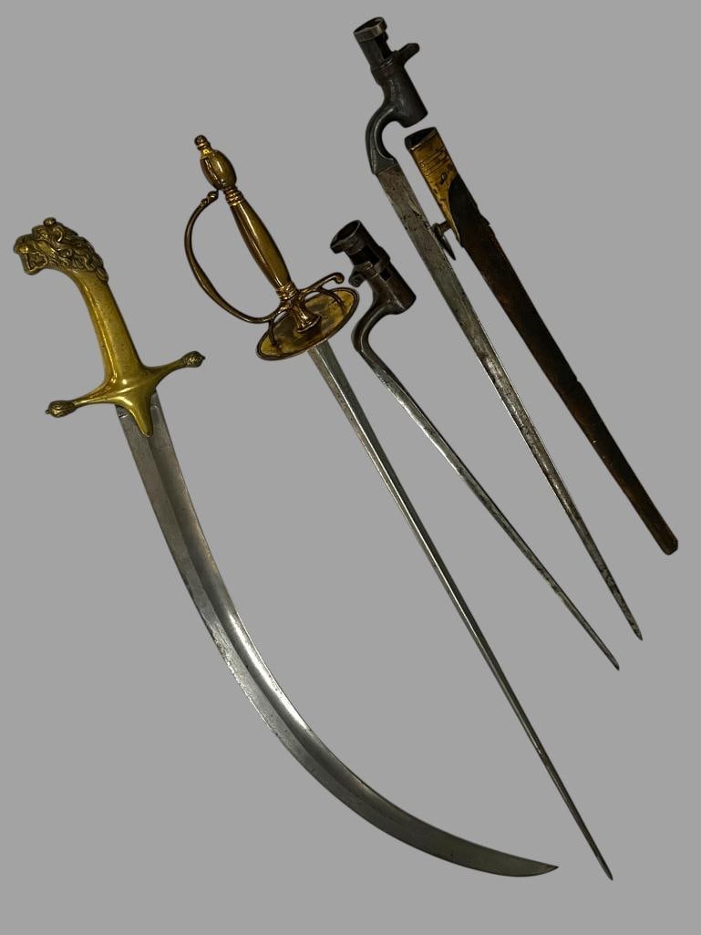Bayonets and Swords: Bayonets and Swords. 4 pieces. Socket bayonets possibly Martini Henry. Sword. approx. 34.5 inches.