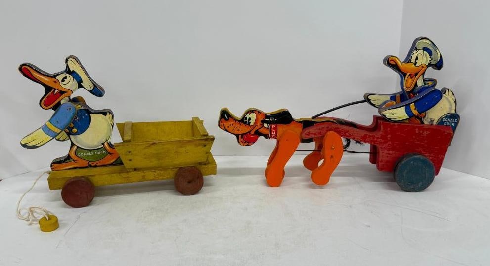 2 Fisher Price Donald Duck Pull Toys: 2 Vintage Fisher Price Donald Duck. One in cart, One with pluto # 149.