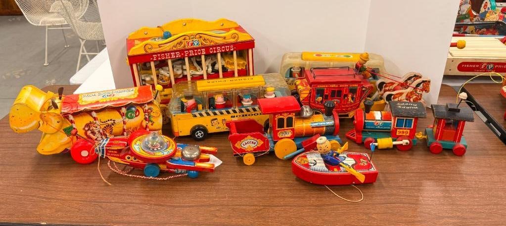 9 Fisher Price Pull Toys: 9 Fisher Price Pull Toys. Boat, Gold Star Stage #175, Looky Chug Chug, Fisher Price Circus with animals Happy Hippo, Huffy Puffy, Space Blazer #750., School bus 983.