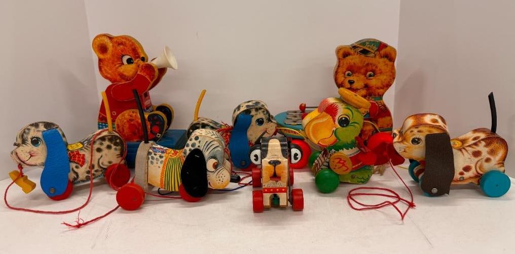 8 Fisher Price Pull Toys: 8 Fisher Price Pull Toys. Teddy Tooter 712, Parrot 698, Teddy Drummer 741, Playful Puppy 626, 625, Barky 462, Nosey 445.