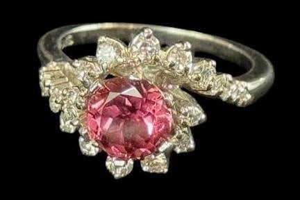 18k Gold ring with Diamonds: 18k Gold ring with Diamonds and Pink stone. Sapphire or Tourmaline. Approx. 5.8 grams. Approx. size 6.5.