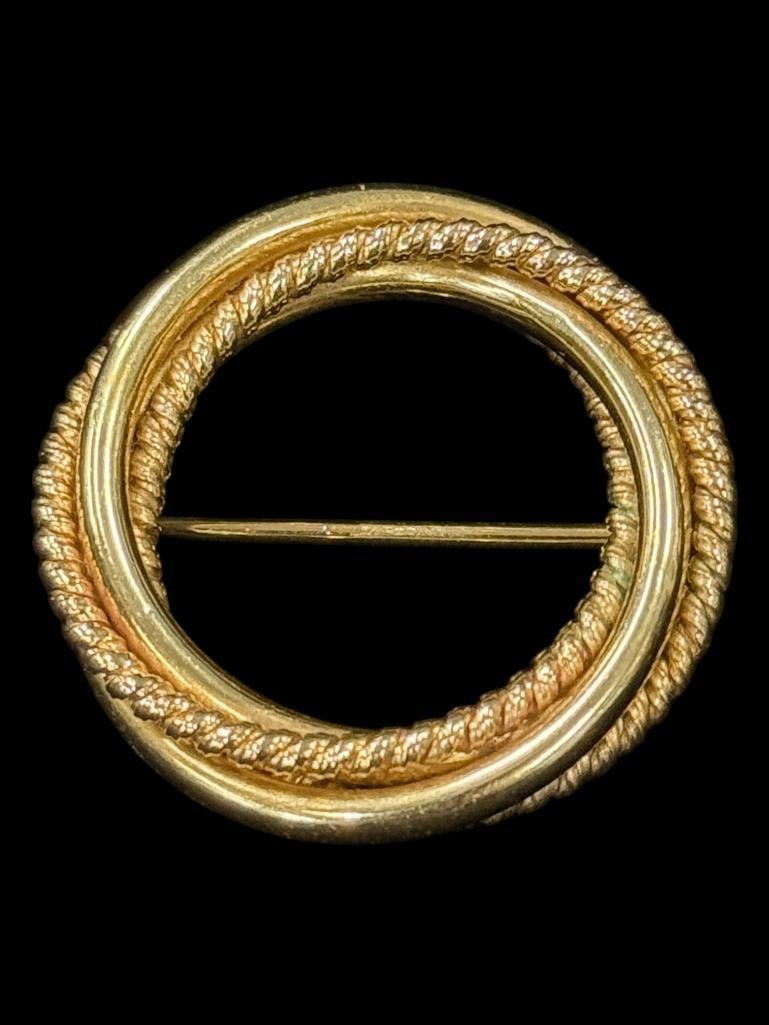 14k Gold Infinity Knot Brooch: 14k Gold Infinity Knot Brooch. Approx. 8.4 grams. Approx. 1 1/8 inches.