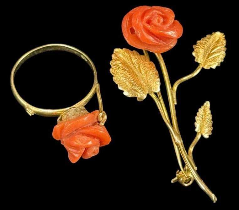 18k Gold Pin and Ring with Coral: 18k Gold Pin and Ring with Coral. 2 pieces. Approx. 6.7 grams. Ring approx. size 7.25. Pin approx. 2 inches.