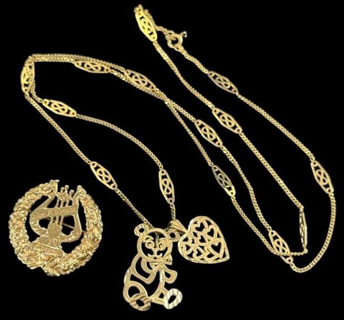 14k Gold Necklace and Pin: 14k Gold Necklace with heart and bear charm. With 14k musicians pin. 2 pieces. Approx. 11.8 grams.