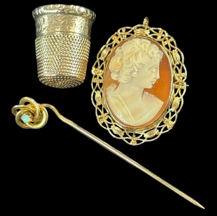 14k Gold Cameo, Pin and Thimble: 14k Gold Cameo, Pin and Thimble. 3 pieces. Approx. 9.7 grams total.