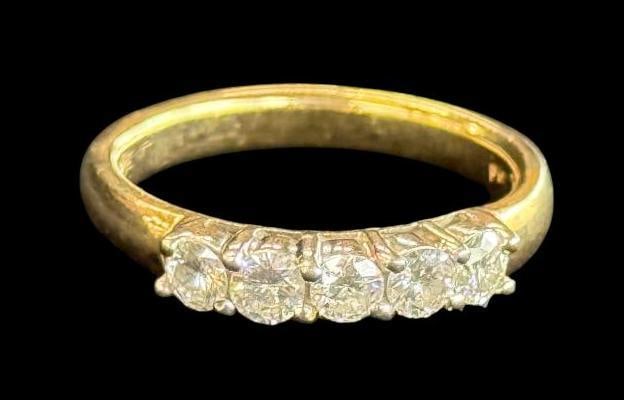 14k Gold and Diamond Wedding Band: 14k Gold and .75 ctw. Diamond Wedding Band. Approx. 6.2 grams. Approx. size 9.5.